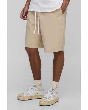 BoohooMAN Tall Elasticated Waist Baggy Fit Shorts - Natural