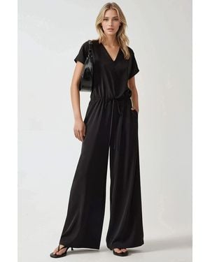 Hiccup Wijde Croptop Jumpsuit Met V-Hals - Zwart