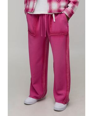 BoohooMAN Baggy Fit Exposed Seam Spray Wash Jogger - Pink