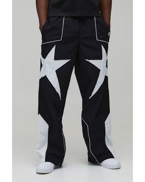 BoohooMAN Tall Baggy Star Panel Track Trousers - Black