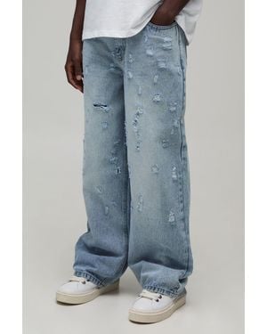 BoohooMAN Fade Wash Extreme Distressed Baggy Fit Jeans - Blue