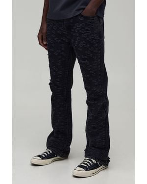 BoohooMAN All Over Ripped Stacked Gusset Slim Flared Jeans - Black