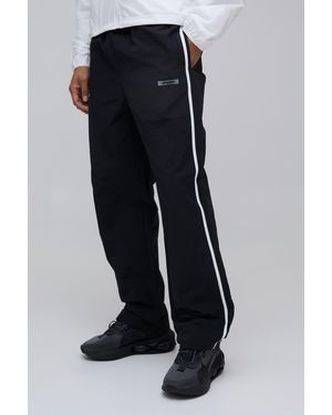BoohooMAN Relaxed Fit Side Stripe Logo Print Nylon Trousers - Black