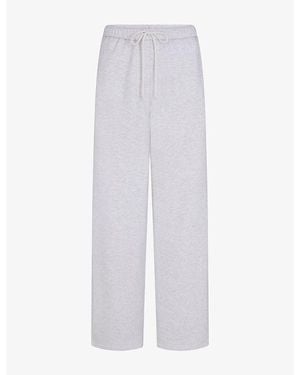 Skims Classic Brand-Appliqué Straight-Leg Cotton-Blend Trousers - White