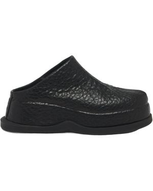 McQueen Wave Skull Embossed Mules - Black