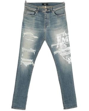 Amiri Ripped Graphic Printed Jeans - Blue