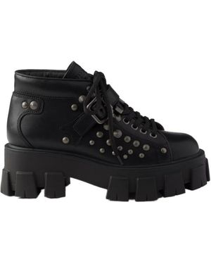 Prada Monolith Studded Leather Booties - Black