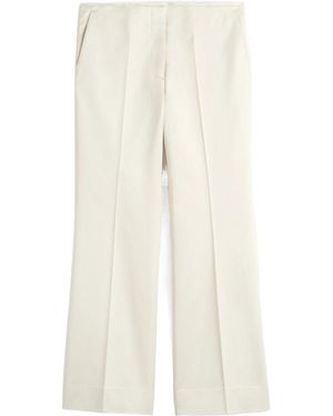 TOTEME Totême Kick Flare Raw-Edge Trousers - White