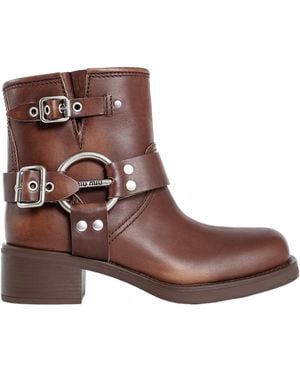 ショートブーツ・ブーティ MIUMIU DARK BROWN LEATHER ANKLE BOOTS Studded suede ankle boots in brown - Miu Miu | Mytheresa
