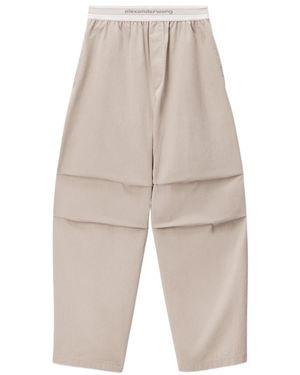 Alexander Wang Logo-Elastic Pleated-Knee Trousers - Natural