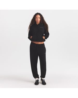 Skims Zip Up Hoodie With Embossed Logo - Black