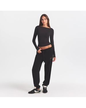 Skims Jogger Pants With Embossed Logo - Black