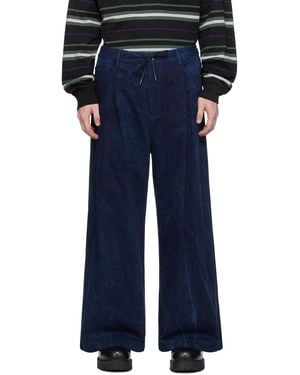 Juun.J Jean ample indigo en denim lavé à l'huile - Bleu