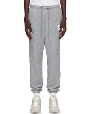 Nike Pantalon De Survêtement Gris À Écusson À Logo