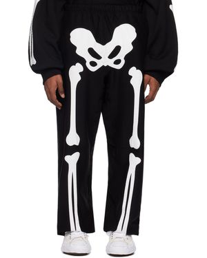 TAKAHIROMIYASHITA TheSoloist. Pantalon de survêtement noir à appliqués d'os type01