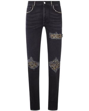 Amiri Skinny Jeans With Studs And Destroy Details - Blue