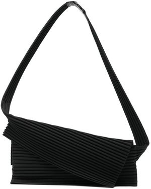 Men's Homme Plissé Issey Miyake Messenger bags from $210 | Lyst