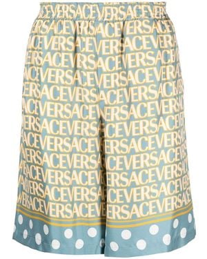 Versace Stylish Silk Bermuda Shorts With All-Over Logo - Yellow