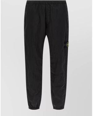 Stone Island Trousers Elastic Waistband Cuffs Back And Side Pockets - Black