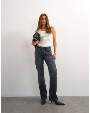 TOPSHOP X Cara Mid Rise Slim Straight Jean - Black
