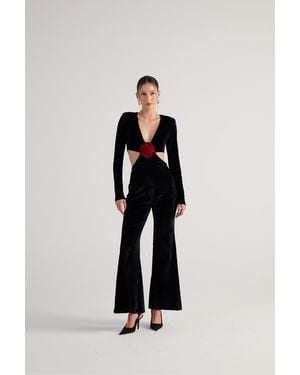 HOLLY LOLLY Spanischer Jumpsuit Mit V-Ausschnitt, Blumenmuster Und Tiefem Ausschnitt, Langen Ärmeln Und Spanischem Bein - Schwarz