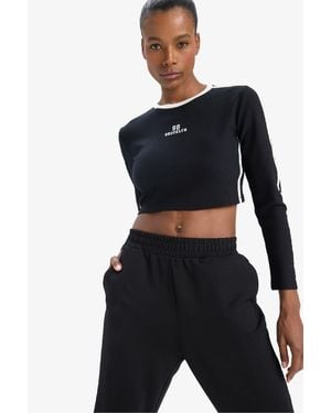 Defacto Fit Slim Fit Slim Fit Rundhalsausschnitt Bedrucktes Sport-Langarm-T-Shirt Für Damen - Schwarz