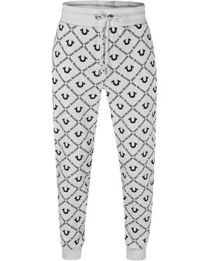 True Religion Allover Logo Joggers in Black for Men Lyst UK