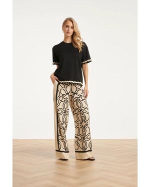 Smashed Lemon Crème Wide Leg Broek Met Zwart Grafisch Patroon - Naturel