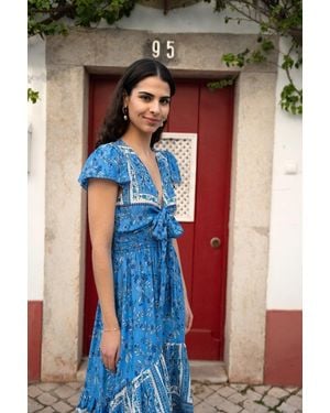 Mela Ditsy Print Sun Dress With Cross Over Back Tie Front And Dip Hem - Blue