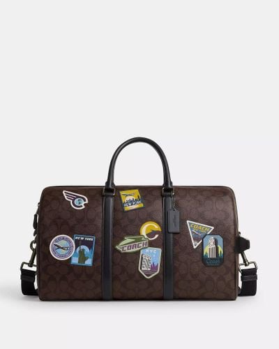 COACH Venturer Bag With Travel Patches - Brown | Pvc - Black