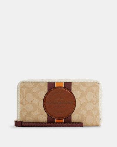 COACH Dempsey Large Phone Wallet - Brown | Cotton - Black