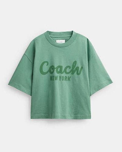 COACH Verkürztes T-Shirt mit kursiver Signature - Grün