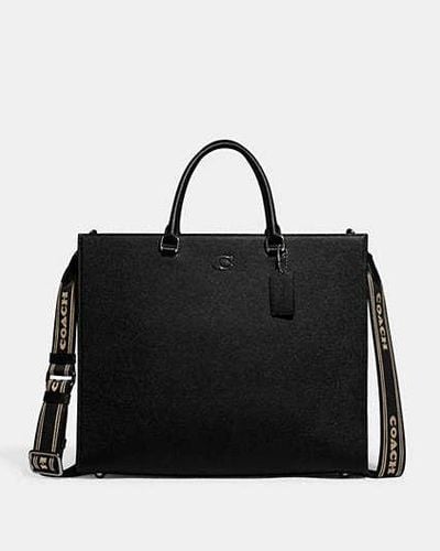 COACH Bolso tote 40 con detalle en lona de firma - Negro