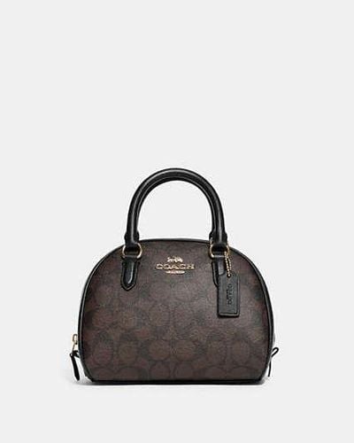 COACH Sydney Satchel aus Signature-Canvas - Schwarz