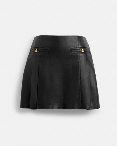 COACH Mini-jupe en cuir Heritage C - Noir