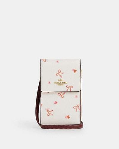 COACH North South Phone Crossbody Bag With Bow Print | Pvc - White