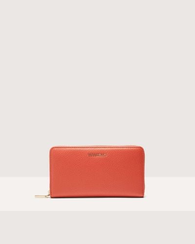 Coccinelle Große Brieftasche aus genarbtem Leder mit umlaufendem Reißverschluss Metallic Soft - Rot