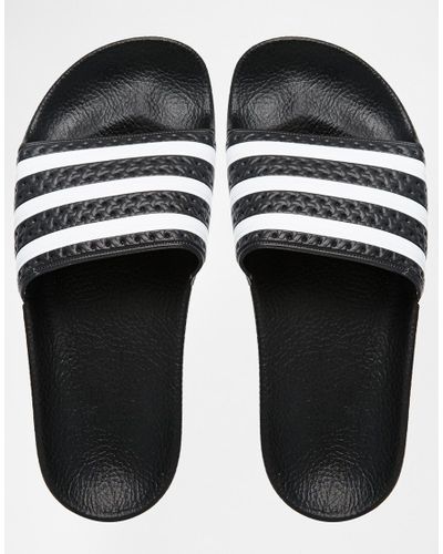 adidas black and white flip flops
