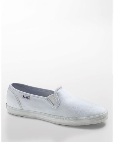 white canvas slip on keds