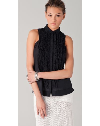 black high neck sleeveless blouse