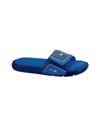 blue and white nike slides