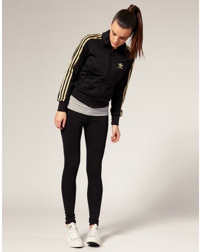 black and gold adidas track top