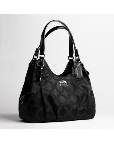 silver coach purse with purple lining