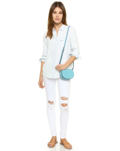 tory burch saddle bolsa