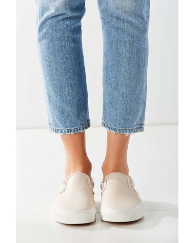cream colored slip on vans