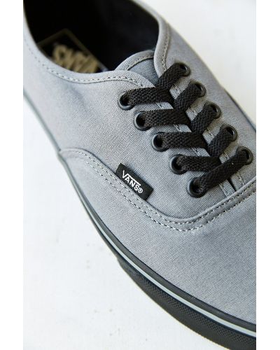 grey vans black sole
