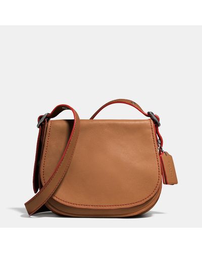 coach glovetanned saddle bolsa