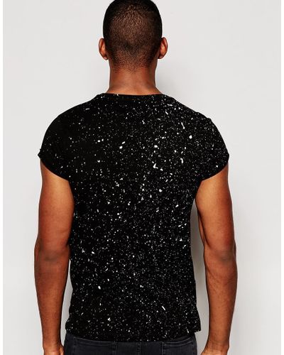 black shirt with paint splatter