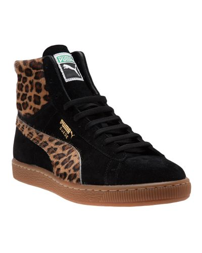 leopard and black trainers