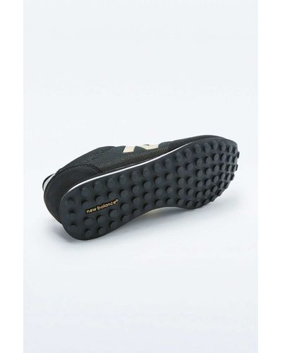 New Balance 410 Black And Gold Trainers 